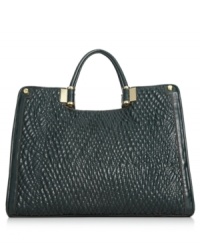 Effortlessly on-trend, this versatile shopper from Ivanka Trump looks chic on or off duty. Faux marled-embossed leather is accented with golden hardware, while the spacious interior stows essentials with ease. Effortlessly on-trend, this versatile shopper from Ivanka Trump looks chic on or off duty. Faux marled-embossed leather is accented with golden hardware, while the spacious interior stows essentials with ease.