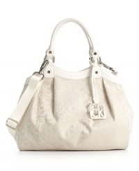 In logo jacquard fabric with an optional crossbody strap, the monogram Hudson purse by Calvin Klein dresses up or down. In logo jacquard fabric with an optional crossbody strap, the monogram Hudson purse by Calvin Klein dresses up or down.