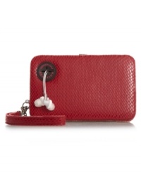 This tech-savy design was created for the girl-on-the-go. This Kenneth Cole Reaction design features an all-over snake skin print, interior card compartments and a corner cut-out that easily allows you to listen to headphones. This tech-savy design was created for the girl-on-the-go. This Kenneth Cole Reaction design features an all-over snake skin print, interior card compartments and a corner cut-out that easily allows you to listen to headphones.