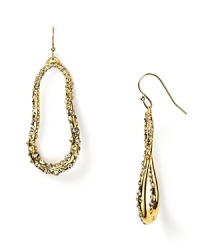 Undulating oval hoops in richly gleaming 14 Kt. gold fill, encrusted with sparkling Swarovski crystals. Undulating oval hoops in richly gleaming 14 Kt. gold fill, encrusted with sparkling Swarovski crystals.