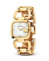 A Gucci bracelet watch with gold-tone links makes a luxe presentation with a mother of pearl face. A Gucci bracelet watch with gold-tone links makes a luxe presentation with a mother of pearl face.
