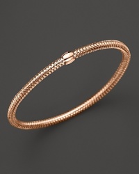 A modern mesh bangle in 18K rose gold from Roberto Coin. A modern mesh bangle in 18K rose gold from Roberto Coin.