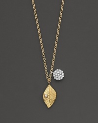 A gold leaf has a diamond accent and is paired with a diamond pavé medallion. Designed by Meira T. A gold leaf has a diamond accent and is paired with a diamond pavé medallion. Designed by Meira T.