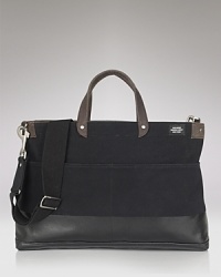 A sleek Jack Spade bag that means business. Hand-dipped in rubber latex with a reinforced, waterproof bottom for durability . A sleek Jack Spade bag that means business. Hand-dipped in rubber latex with a reinforced, waterproof bottom for durability .