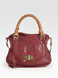 Mixing contrasting textures and rich tones, this crossbody design of extra-smooth sheepskin leather is a versatile must-have item. Tennis-wrapped double top handles, 6 dropDetachable crossbody strap, 19 dropTop zip closureHidden open pocket under front flapOne inside zip pocketOne inside open pocketCotton lining14½W X 11H X 4½DMade in Italy Mixing contrasting textures and rich tones, this crossbody design of extra-smooth sheepskin leather is a versatile must-have item. Tennis-wrapped double top handles, 6 dropDetachable crossbody strap, 19 dropTop zip closureHidden open pocket under front flapOne inside zip pocketOne inside open pocketCotton lining14½W X 11H X 4½DMade in Italy