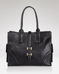With its easy, spacious silhouette and (multiple!) pockets, this leather crafted Foley + Corinna tote is our definition of day-right perfection. A belt flap closure adds vintage-inspired allure to this modern must-have. With its easy, spacious silhouette and (multiple!) pockets, this leather crafted Foley + Corinna tote is our definition of day-right perfection. A belt flap closure adds vintage-inspired allure to this modern must-have.