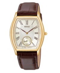 The best of both worlds: modern function with vintage appeal. Leather strap with embossed crocodile pattern. Goldtone stainless steel case, 33mm. Champagne-colored dial with elegant roman numeral and seconds-hand subdial at 6 o'clock. Analog movement. Water resistant to 50 meters. Three-year limited warranty. The best of both worlds: modern function with vintage appeal. Leather strap with embossed crocodile pattern. Goldtone stainless steel case, 33mm. Champagne-colored dial with elegant roman numeral and seconds-hand subdial at 6 o'clock. Analog movement. Water resistant to 50 meters. Three-year limited warranty.