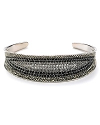 Crystal stones dress up this Judith Jack cuff and offer a glamorous complement to its striking sterling silver setting. Crystal stones dress up this Judith Jack cuff and offer a glamorous complement to its striking sterling silver setting.