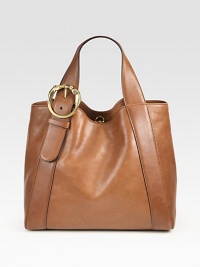 Washed leather style with a double horse-heads buckle and antique goldtone hardware. Double top handles, 8 dropInterior hook closureOne inside zip pocketTwo inside open pocketsNatural cotton linen lining13¼W X 12¼H X 5¼DMade in Italy Washed leather style with a double horse-heads buckle and antique goldtone hardware. Double top handles, 8 dropInterior hook closureOne inside zip pocketTwo inside open pocketsNatural cotton linen lining13¼W X 12¼H X 5¼DMade in Italy