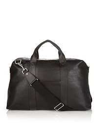 Soft grained leather duffel bag with zipper and top handles. Two slip pockets on each side. Interior pockets for organizing. Optional strap for carryon. Soft grained leather duffel bag with zipper and top handles. Two slip pockets on each side. Interior pockets for organizing. Optional strap for carryon.