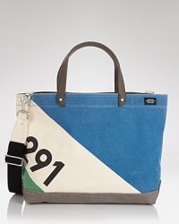 Featuring a cool color-block design with a printed number graphic, this tote is ideal for carrying to the beach and handles all your essentials for your trips downtown, too. Featuring a cool color-block design with a printed number graphic, this tote is ideal for carrying to the beach and handles all your essentials for your trips downtown, too.