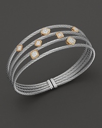 From the Classique collection, cuff bracelet with yellow gold and diamond stations on stainless steel cable. Designed by Charriol. From the Classique collection, cuff bracelet with yellow gold and diamond stations on stainless steel cable. Designed by Charriol.