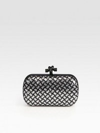 Glittering sequin allover leather, this petite design with a diamond-shape pattern and an unique knot detailed closure will definitely stand out in a crowd.Top clasp closureSuede lining7¼W X 4¼H X ¾DMade in Italy Glittering sequin allover leather, this petite design with a diamond-shape pattern and an unique knot detailed closure will definitely stand out in a crowd.Top clasp closureSuede lining7¼W X 4¼H X ¾DMade in Italy