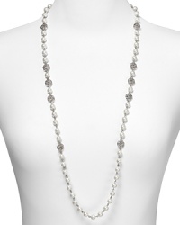 Take an upper crust approach to accessorizing with this long strand pearl from Lauren Ralph Lauren. Embellished with crystal stations, it speaks to a refined aesthetic. Take an upper crust approach to accessorizing with this long strand pearl from Lauren Ralph Lauren. Embellished with crystal stations, it speaks to a refined aesthetic.