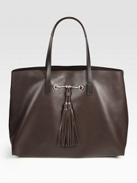 Spacious leather tote with double tassels and signature horsebit hardware. Shoulder straps, 8 dropOne inner zipper pouch17W X 12H X 6DMade in Italy Spacious leather tote with double tassels and signature horsebit hardware. Shoulder straps, 8 dropOne inner zipper pouch17W X 12H X 6DMade in Italy