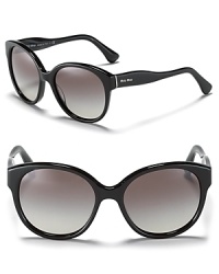 Make waves in these round oversized sunglasses with curvy temples. By Miu Miu. Make waves in these round oversized sunglasses with curvy temples. By Miu Miu.