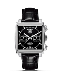 TAG Heuer's iconic Monaco series remains a legend more than 40 years after Steve McQueen debuted it in the film Le Mans. The first water-resistant square chronograph, it was revolutionary both in technical achievement and design, and remains so to this day. Features a black dial on black alligator strap. TAG Heuer's iconic Monaco series remains a legend more than 40 years after Steve McQueen debuted it in the film Le Mans. The first water-resistant square chronograph, it was revolutionary both in technical achievement and design, and remains so to this day. Features a black dial on black alligator strap.