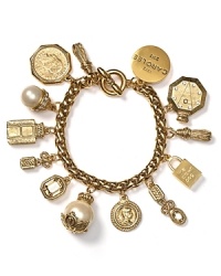 Break out the baubles. To mark the brand's 40-year anniversary Carolee has issued this limited edition charm bracelet, boasting pearl dangles and commemorative tokens. Break out the baubles. To mark the brand's 40-year anniversary Carolee has issued this limited edition charm bracelet, boasting pearl dangles and commemorative tokens.
