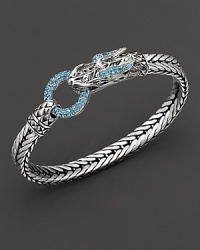Eastern elements inform John Hardy's dragon head bracelet, featuring a polished silver link band and dragon head clasp with Swiss blue topaz. Eastern elements inform John Hardy's dragon head bracelet, featuring a polished silver link band and dragon head clasp with Swiss blue topaz.