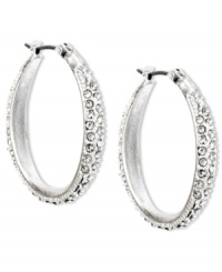 Stylish with a classic aesthetic. Enchanting crystal pave accents add flair to these oval hoop earrings from Jones New York. Crafted with worn silver tone mixed metal. Approximate drop: 1-1/4 inches. Approximate diameter: 1 inch. Stylish with a classic aesthetic. Enchanting crystal pave accents add flair to these oval hoop earrings from Jones New York. Crafted with worn silver tone mixed metal. Approximate drop: 1-1/4 inches. Approximate diameter: 1 inch.