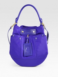 An easy style crafted of smooth nylon and contrast leather trim, finished with a stylish luggage tag. Leather top handle, 8 dropLeather removable adjustable shoulder strap, 17¾-20½ dropMagnetic top closureThree outside open pocketsOne inside zip pocketTwo inside open pocketsNylon lining14W X 13¾H X 2DImportedPlease note: Hardware color varies by bag. An easy style crafted of smooth nylon and contrast leather trim, finished with a stylish luggage tag. Leather top handle, 8 dropLeather removable adjustable shoulder strap, 17¾-20½ dropMagnetic top closureThree outside open pocketsOne inside zip pocketTwo inside open pocketsNylon lining14W X 13¾H X 2DImportedPlease note: Hardware color varies by bag.