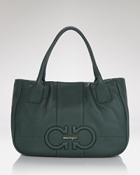 We love the day-right proportions of this Salvatore Ferragamo tote. A classic addition to your purse portfolio, this luxurious leather piece flaunts a timeless design that will see you from season to season. We love the day-right proportions of this Salvatore Ferragamo tote. A classic addition to your purse portfolio, this luxurious leather piece flaunts a timeless design that will see you from season to season.