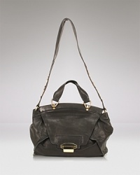 This spacious satchel from Kooba is a natural for busy days, crafted of lived-in leather with a coolly versatile shape that can be worn over the shoulder or on your arm. This spacious satchel from Kooba is a natural for busy days, crafted of lived-in leather with a coolly versatile shape that can be worn over the shoulder or on your arm.