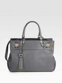Sumptuous butter leather in an impeccably tailored design, accented by top-cinching buckles and polished hardware.Double top handles, 6 dropShoulder strap, 18 dropOne outside magnetic pocketProtective metal feetCenter zip compartmentOne inside zip pocketTwo inside open pocketsFully lined15W X 10½H X 5½DMade in Italy Sumptuous butter leather in an impeccably tailored design, accented by top-cinching buckles and polished hardware.Double top handles, 6 dropShoulder strap, 18 dropOne outside magnetic pocketProtective metal feetCenter zip compartmentOne inside zip pocketTwo inside open pocketsFully lined15W X 10½H X 5½DMade in Italy