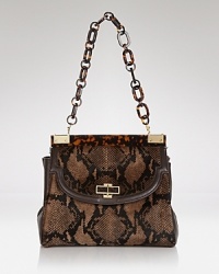 Well-heeled women will appreciate this Tory Burch shoulder bag, crafted for maximum impact in a mix of calf hair and leather with a distinctly polished shape. Well-heeled women will appreciate this Tory Burch shoulder bag, crafted for maximum impact in a mix of calf hair and leather with a distinctly polished shape.