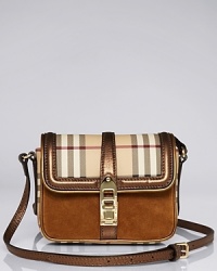 A premium piece for day, this Burberry crossbody refines a day-to-night look, detailed with a turnlock closure. The compact piece features a well-organized interior with multiple card pockets. A premium piece for day, this Burberry crossbody refines a day-to-night look, detailed with a turnlock closure. The compact piece features a well-organized interior with multiple card pockets.