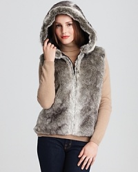 Statement-making style starts with this faux fur hooded vest from Surell. Statement-making style starts with this faux fur hooded vest from Surell.