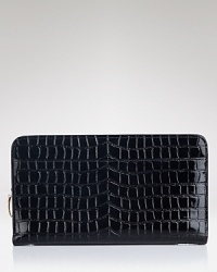 As much as we love an over-the-top it-bag, this Tusk leather wristlet has our full attention with its effortless versatility: think pockets a plenty and a hidden wrist strap. As much as we love an over-the-top it-bag, this Tusk leather wristlet has our full attention with its effortless versatility: think pockets a plenty and a hidden wrist strap.
