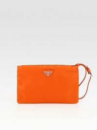Sleek nylon bag with an adjustable wristlet strap.Adjustable strap, 2-3 dropTop zip closureOne inside zip pocketSignature jacquard lining8¼W X 5¼H X 1/2DMade in Italy Sleek nylon bag with an adjustable wristlet strap.Adjustable strap, 2-3 dropTop zip closureOne inside zip pocketSignature jacquard lining8¼W X 5¼H X 1/2DMade in Italy