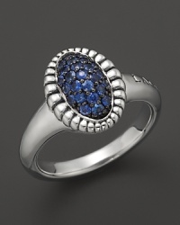 A fluted edge in sterling silver frames sparkling blue sapphires. From Lagos. A fluted edge in sterling silver frames sparkling blue sapphires. From Lagos.
