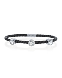 This striking 18K white gold and black cable bracelet, studded with three glittering white topaz stations, is perfect for stacking. This striking 18K white gold and black cable bracelet, studded with three glittering white topaz stations, is perfect for stacking.