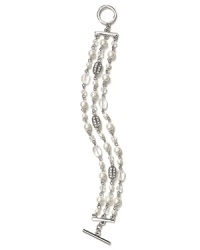 Strands of shimmering glass pearls are a graceful focal point on this three row Lauren Ralph Lauren bracelet, finished with a simple toggle closure. Strands of shimmering glass pearls are a graceful focal point on this three row Lauren Ralph Lauren bracelet, finished with a simple toggle closure.