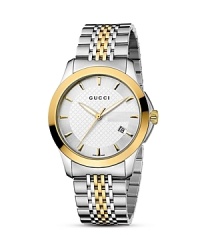 A stainless steel and 18K gold watch from the Gucci G-Timeless collection. Details include Gucci ‘G' shadow monogram on the watch face and diamond motif discreetly displayed on the dial. A stainless steel and 18K gold watch from the Gucci G-Timeless collection. Details include Gucci ‘G' shadow monogram on the watch face and diamond motif discreetly displayed on the dial.