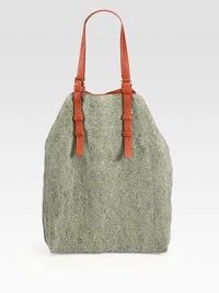 An extra roomy carryall made of pure linen, finished with tonal goatskin leather shoulder straps and simple goldtone studs. Double adjustable leather shoulder straps, 1½-15 dropMagnetic snap closureOne inside open pocketCanvas lining12½W X 16H X 3½DImported An extra roomy carryall made of pure linen, finished with tonal goatskin leather shoulder straps and simple goldtone studs. Double adjustable leather shoulder straps, 1½-15 dropMagnetic snap closureOne inside open pocketCanvas lining12½W X 16H X 3½DImported