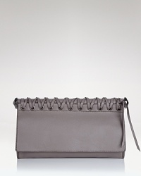 Toughen up your after-hours line up with Oryany's braided leather clutch. In a crave-worthy shape and pared-down palette, this bag loves your darkest dresses and boots. Toughen up your after-hours line up with Oryany's braided leather clutch. In a crave-worthy shape and pared-down palette, this bag loves your darkest dresses and boots.