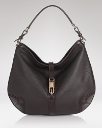 A sleek and simple tab folds over to close this ever-so-luxe hobo from Burberry, a slouchy shape with an effortless feel. A sleek and simple tab folds over to close this ever-so-luxe hobo from Burberry, a slouchy shape with an effortless feel.