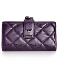 Get organized in the most elegant way with this shiny quilted clutch from Style&co. Ideally sized to slip inside a handbag, it boasts plenty of pockets and compartments for all the essentials. Get organized in the most elegant way with this shiny quilted clutch from Style&co. Ideally sized to slip inside a handbag, it boasts plenty of pockets and compartments for all the essentials.
