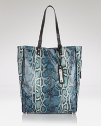 Sam Edelman masters the exotic trend with this practical python-embossed tote. Rich tones and a versatile shape give this can-do carryall round the clock appeal. Sam Edelman masters the exotic trend with this practical python-embossed tote. Rich tones and a versatile shape give this can-do carryall round the clock appeal.