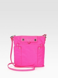 An easy shape made of sturdy nylon, featuring a signature logo and front patch pockets. Adjustable shoulder strap, 20-23¼ dropTop zip closureThree outside open pocketsOne inside zip pocketTwo inside open pocketsFully lined9½W X 10H X ½DImported An easy shape made of sturdy nylon, featuring a signature logo and front patch pockets. Adjustable shoulder strap, 20-23¼ dropTop zip closureThree outside open pocketsOne inside zip pocketTwo inside open pocketsFully lined9½W X 10H X ½DImported