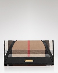 Keep your cash (and card) cache organized with Burberry's check wallet. Take the plaid package into after hours--it doubles as a preppy chic clutch with a black sheath and kitten heels. Keep your cash (and card) cache organized with Burberry's check wallet. Take the plaid package into after hours--it doubles as a preppy chic clutch with a black sheath and kitten heels.
