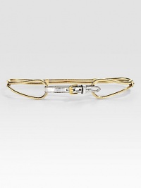 A sleek, metal, snake chain design with a leather center closure. Width, about ½Made in Italy A sleek, metal, snake chain design with a leather center closure. Width, about ½Made in Italy