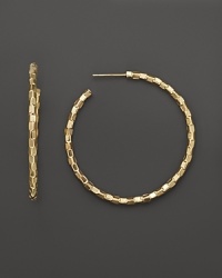 With a unique, woven-like texture, Lana Jewelry's glimmering Decades hoops are crafted in 14K yellow gold. With a unique, woven-like texture, Lana Jewelry's glimmering Decades hoops are crafted in 14K yellow gold.