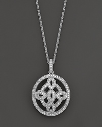 A dramatic oval medallion pendant crafted from white gold and diamonds, dangling from a 16 wheat chain. Domed to offer dimension. A dramatic oval medallion pendant crafted from white gold and diamonds, dangling from a 16 wheat chain. Domed to offer dimension.
