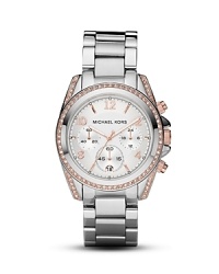 A crystal-encrusted bezel sets this chic watch to sparkle. From MICHAEL Michael Kors. A crystal-encrusted bezel sets this chic watch to sparkle. From MICHAEL Michael Kors.