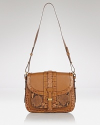 Embrace an exotic mood with this croc and python saddle bag from Michael Kors. This bag's potent patchwork of leathers is a luxe way to take on texture. Embrace an exotic mood with this croc and python saddle bag from Michael Kors. This bag's potent patchwork of leathers is a luxe way to take on texture.