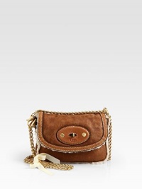 This small design is big on luxury with a ultra-soft shearling frame accented with smooth leather details and radiant hardware.Detachable adjustable chain shoulder strap, 11-20 dropTurnlock flap closure8W X 6H X 1½DImported This small design is big on luxury with a ultra-soft shearling frame accented with smooth leather details and radiant hardware.Detachable adjustable chain shoulder strap, 11-20 dropTurnlock flap closure8W X 6H X 1½DImported